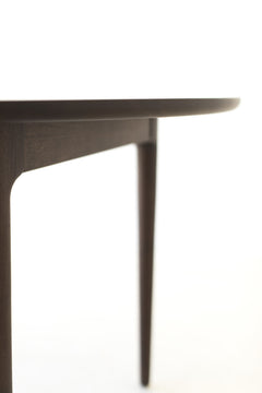 Detail of the matte finish on the walnut dining table