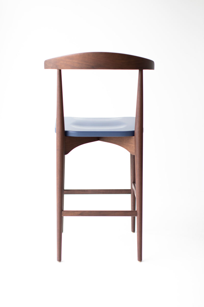 Pair of modern Peabody walnut bar stools styled together