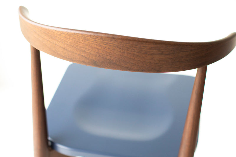 Side profile of the Lawrence Peabody walnut bar stool