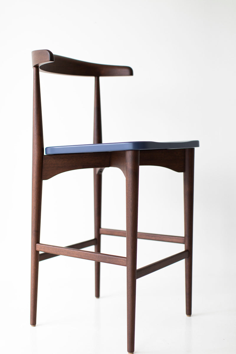 Detail of the walnut wood grain on the bar stool frame