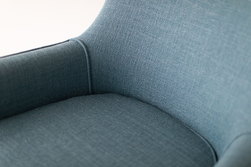 Modern luxury bracket back lounge chair styled in a modern living room