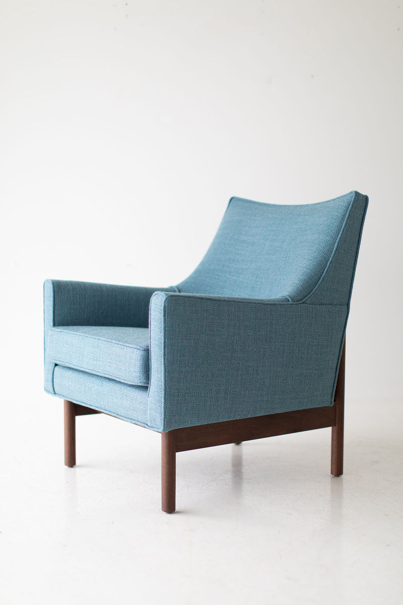Modern luxury Peabody bracket back lounge chair in a styled modern room