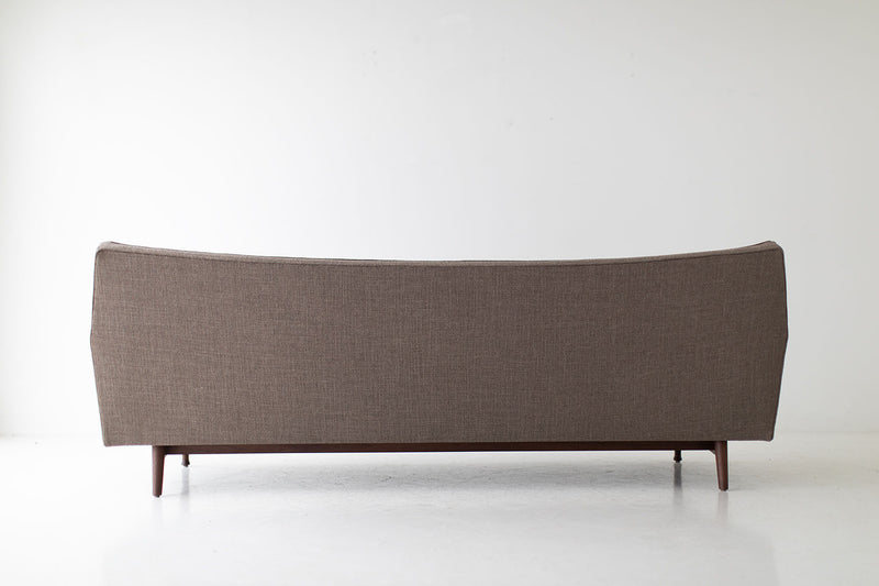 Detail of the walnut wood grain on the sofa