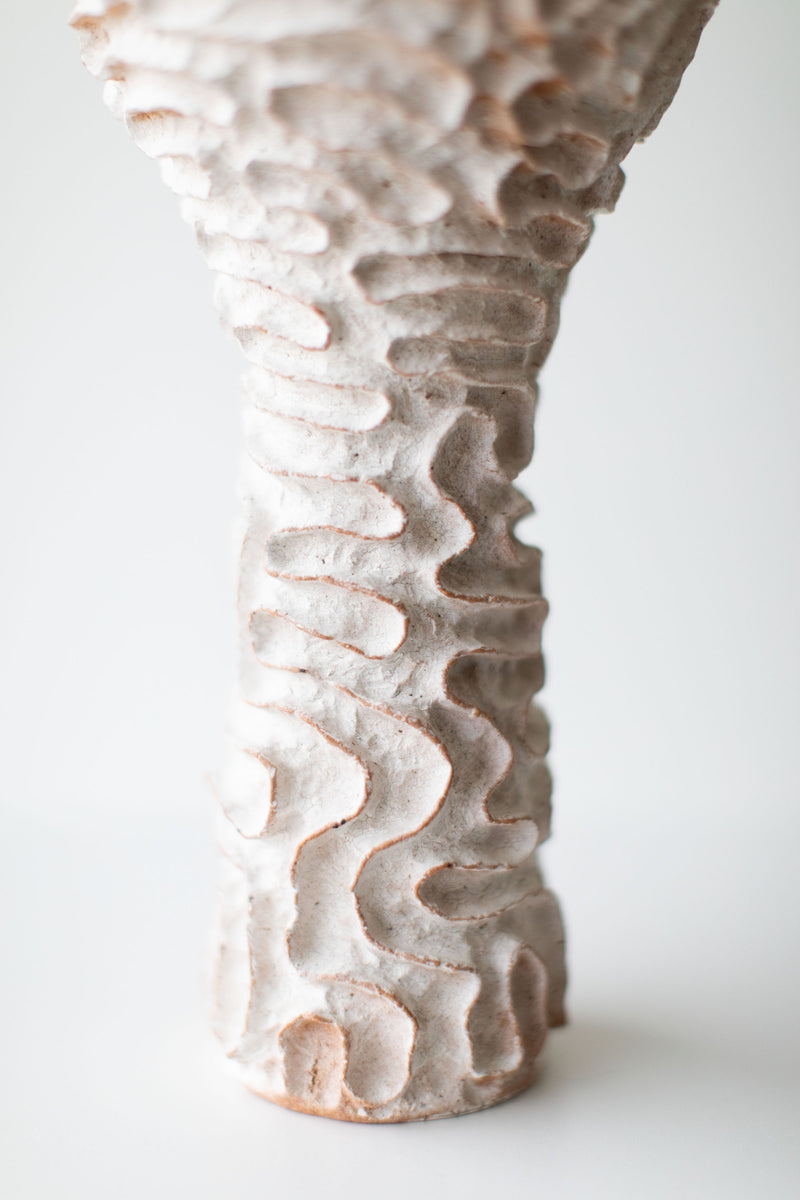 Close-up of the hand-finger-marked surface on the tall vase