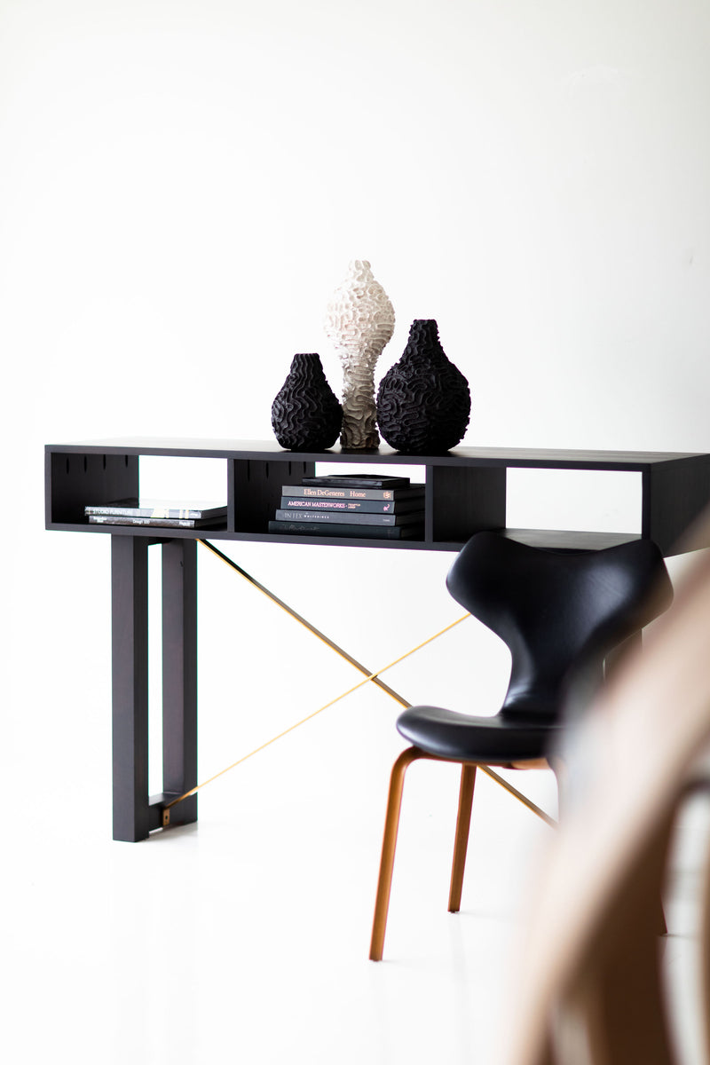 Modern ceramic vase styled in a living room vignette