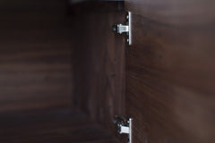Detail of the door pulls on the modern walnut credenza