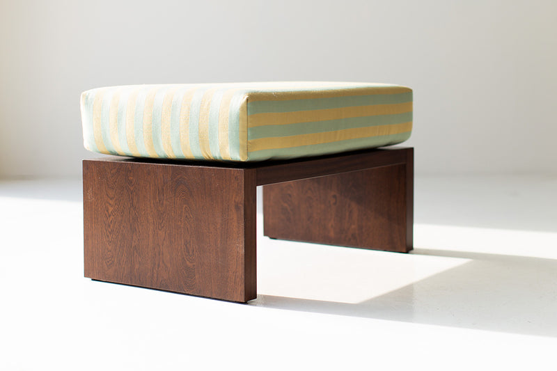 Modern luxury mahogany outdoor ottoman in a walnut finish, front view