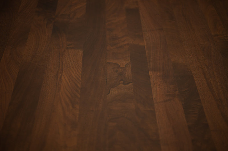 The modern walnut table used as a home office desk