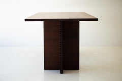 The ninety-inch walnut tabletop seen from above