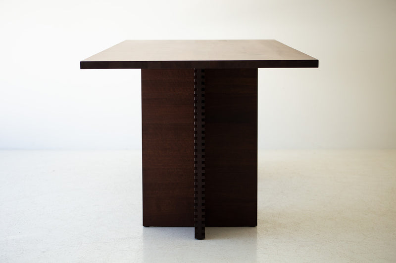 The ninety-inch walnut tabletop seen from above