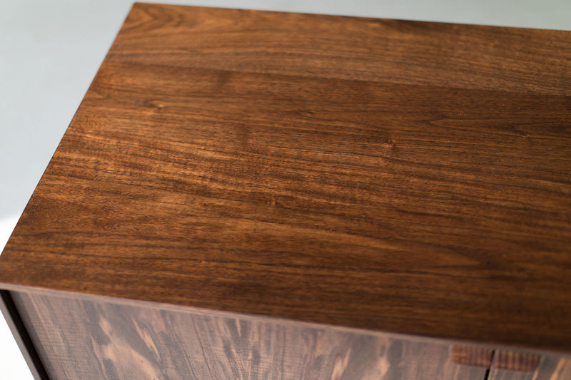Modern luxury walnut Peabody credenza styled in a modern living room