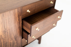 Detail of the turned brass pulls on the modern luxury walnut Peabody credenza