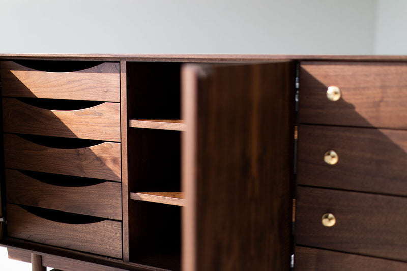 Modern luxury walnut Peabody credenza shown from a low angle