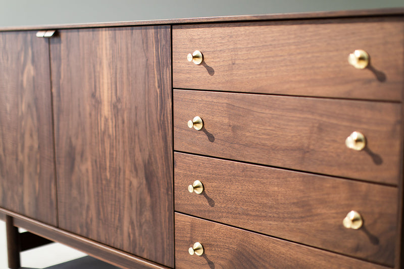 Close-up of the tapered legs on the modern luxury walnut Peabody credenza