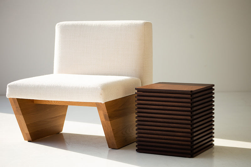 Walnut end table used as a nightstand