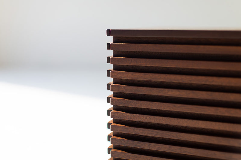 Modern luxury walnut end table in a living room