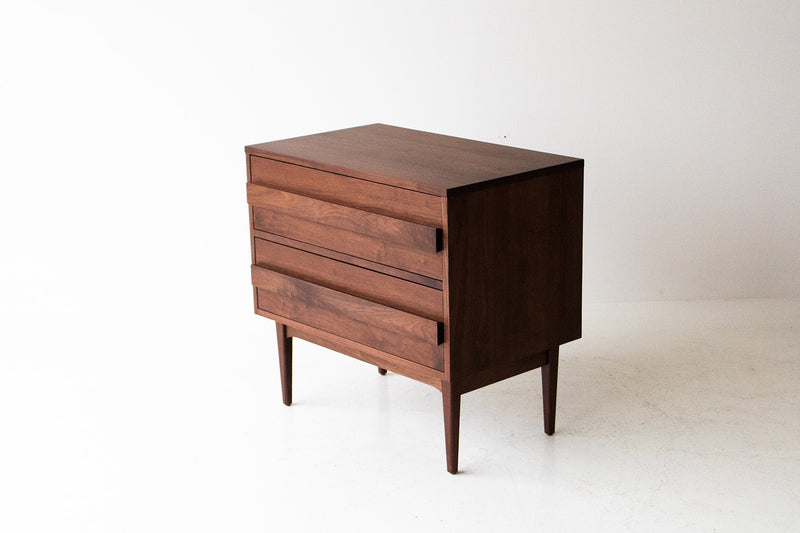 Close-up of the hand-cut dovetail joinery on the modern walnut nightstand drawer