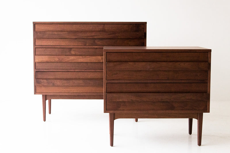 Modern luxury walnut nightstand styled beside a bed