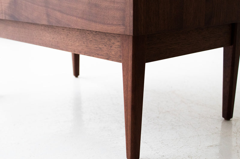 Close-up of the solid walnut grain on the modern nightstand