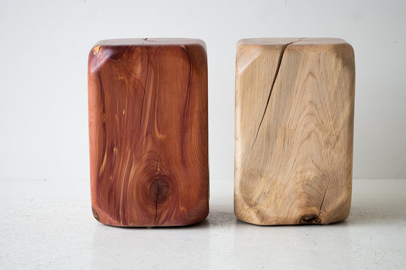 Modern maple stool used as a nightstand