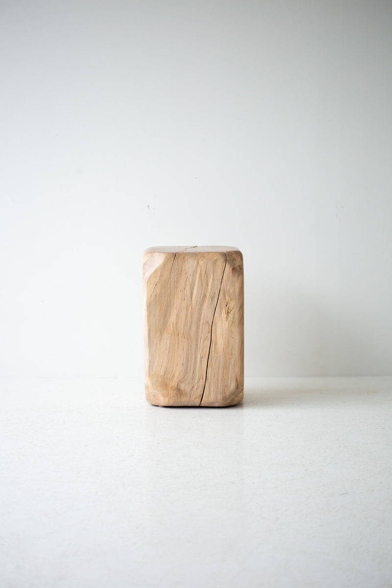 Modern luxury maple stool styled in a bright interior
