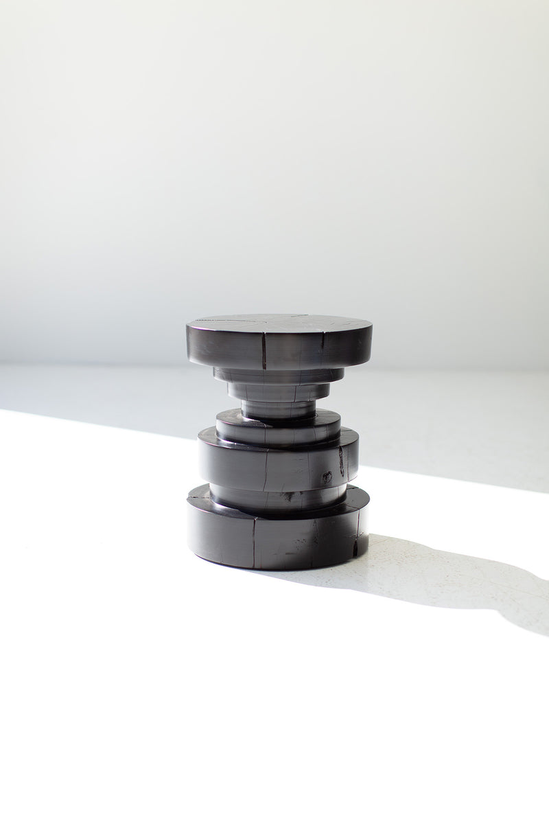 Modern luxury black Tulum stool styled in a bright interior
