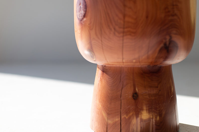 Red cedar Morocco stump table photographed at an angle