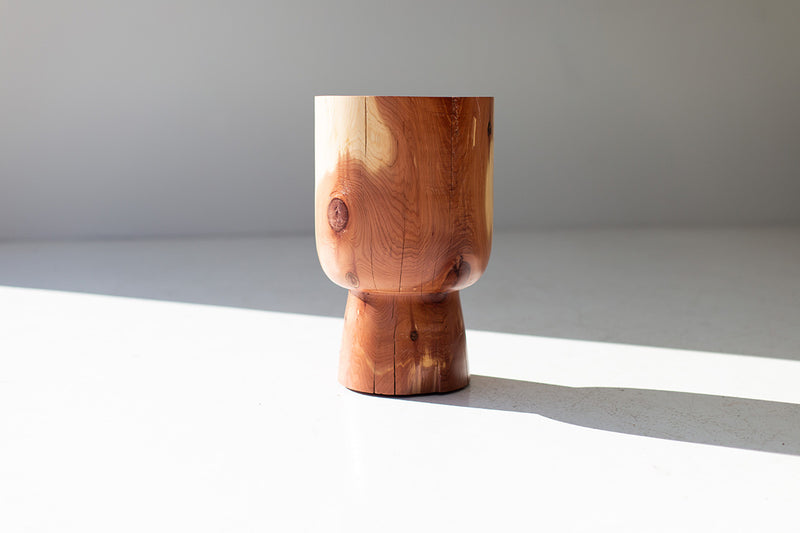 Modern luxury cedar side table beside a bathtub