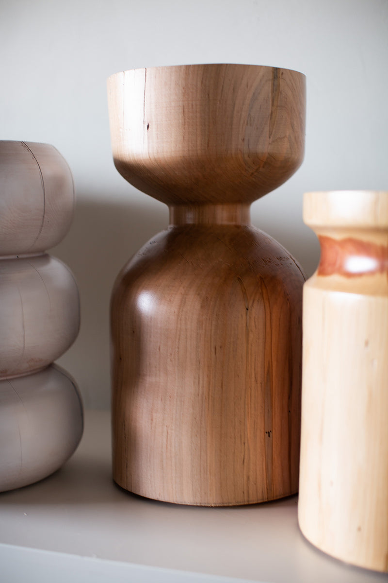 Modern maple side table used as a nightstand