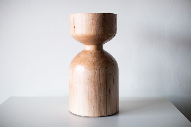 Modern luxury maple side table in a bright organic modern interior