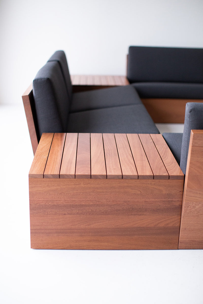 Modern luxury mahogany end table styled on an outdoor patio
