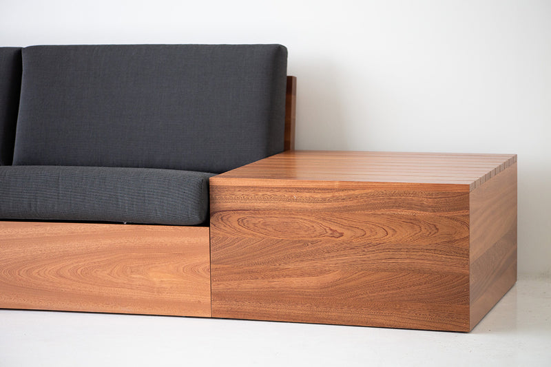 Modern luxury Bali sofa styled on a sunlit patio