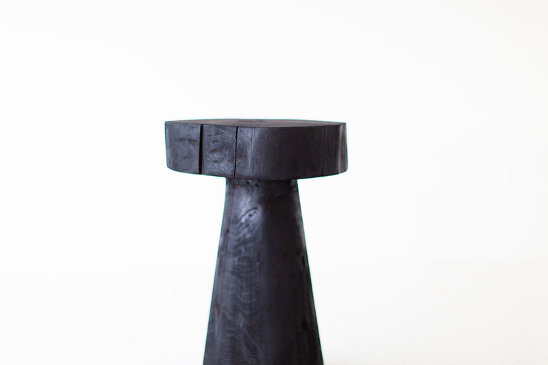 Shou sugi ban side table shown at an angle