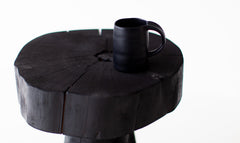 Modern luxury shou sugi ban side table styled in a living room