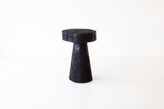 Organic modern shou sugi ban table styled in a bright interior