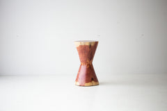 Close-up of the natural red cedar grain and character cracking on The Hourglass