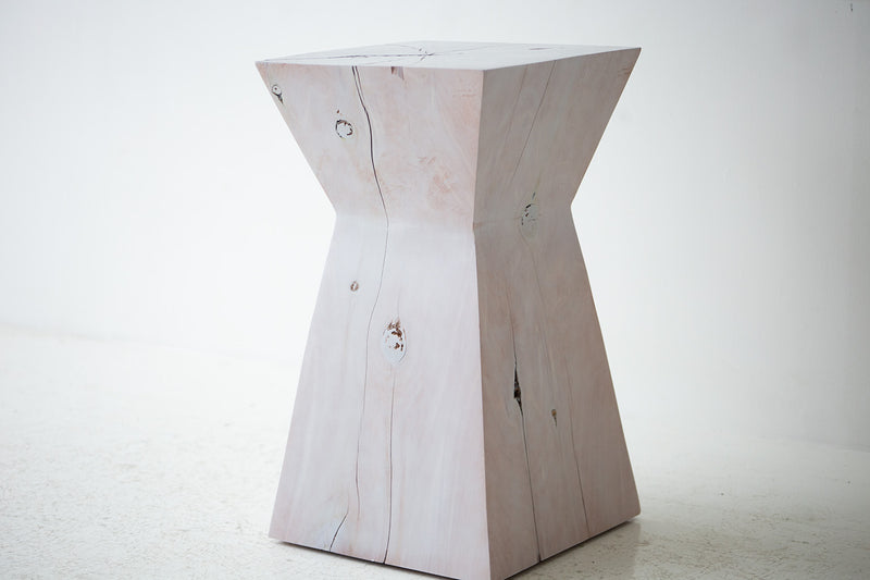 Modern luxury maple stump used as a bedside nightstand