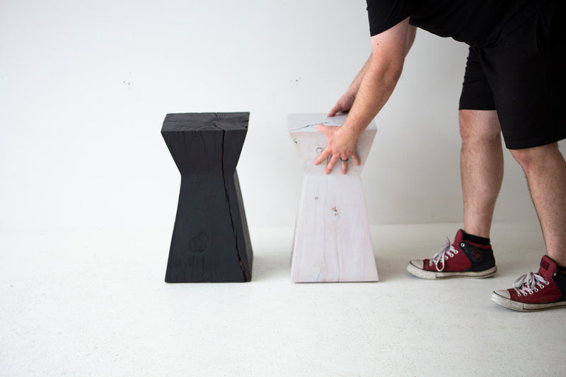 Modern luxury maple stump side table placed beside a sofa