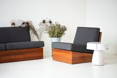 The Summit wood stump side table styled beside a modern sofa