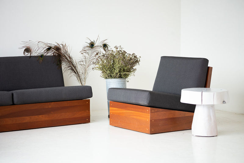 The Summit wood stump side table styled beside a modern sofa