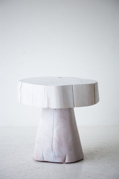 Several Summit stump tables grouped as an organic modern coffee-table cluster