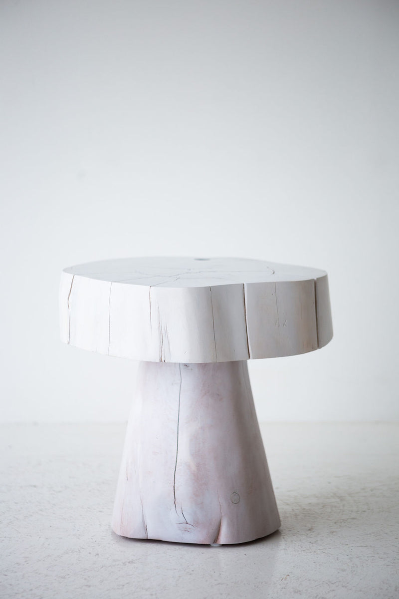 Several Summit stump tables grouped as an organic modern coffee-table cluster