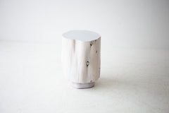 Close-up of the tall totem silhouette on the red cedar stump table
