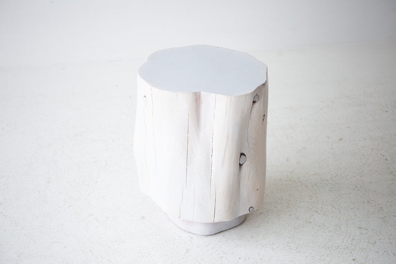 Side profile of The Totem tall sculpted stump side table