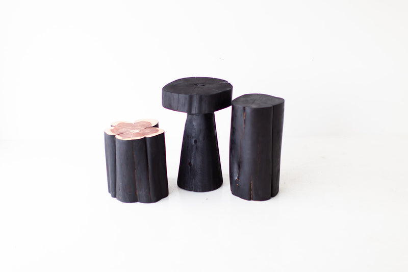 Modern luxury shou sugi ban stump table styled in a living room