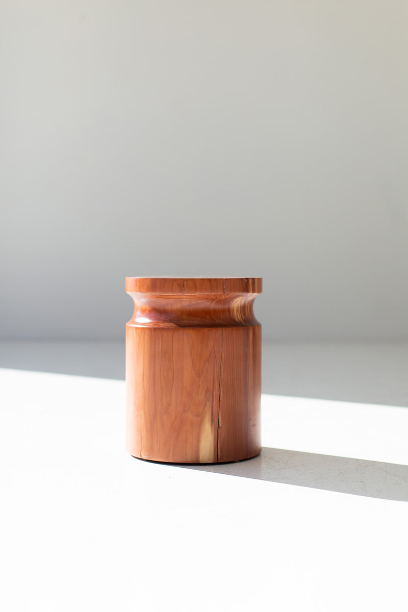Small side table styled in a bright interior