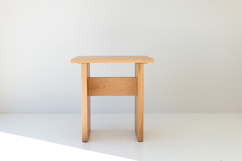 The Toko, an organic modern white oak game table, front view