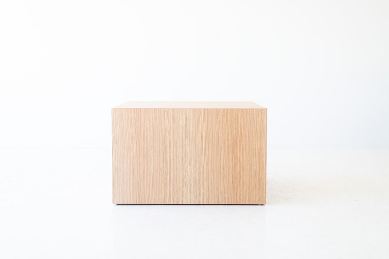 Modern white oak side table styled as a plant stand