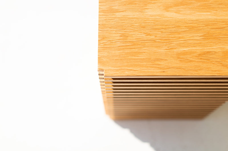 Modern luxury white oak side table in a living room