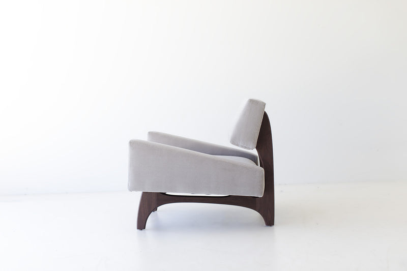 Back view of the Canadian lounge chair showing its walnut frame